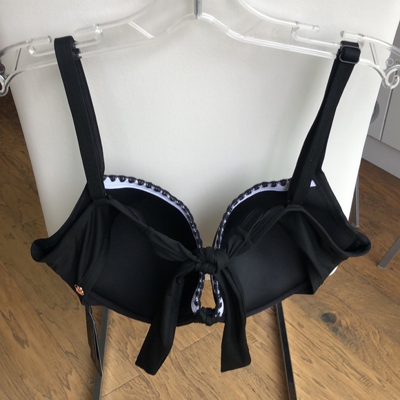 Black bikini top with white trim. - Picture 2 of 4